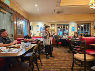 Jenny, dog trainer, speaking in front of Business Breakfast Group.